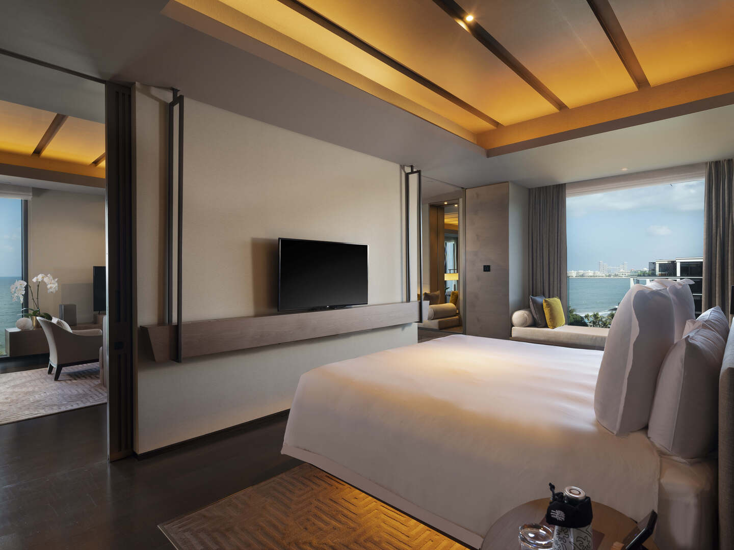 Luxurious Banyan Tree Dubai family suite with sea views, warm lighting, and modern decor.